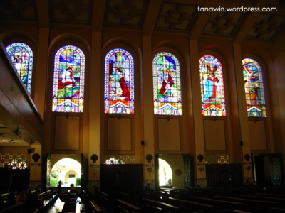 Stained glass windows on the left side of the church